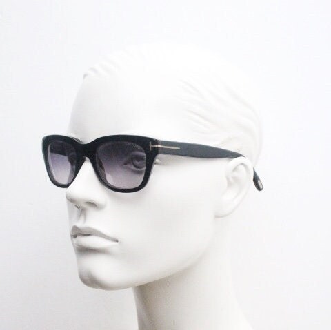 Tom Ford vintage modified wayfarer sunglasses made in Italy. Slightly cat eye form in black gloss acetate with superb graduating lenses