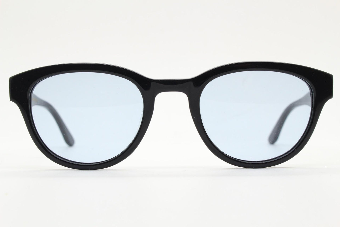 Vintage modified wayfarer design sunglasses. Black gloss acetate frame with extra light tone blue lenses in ideal proportions. NOS