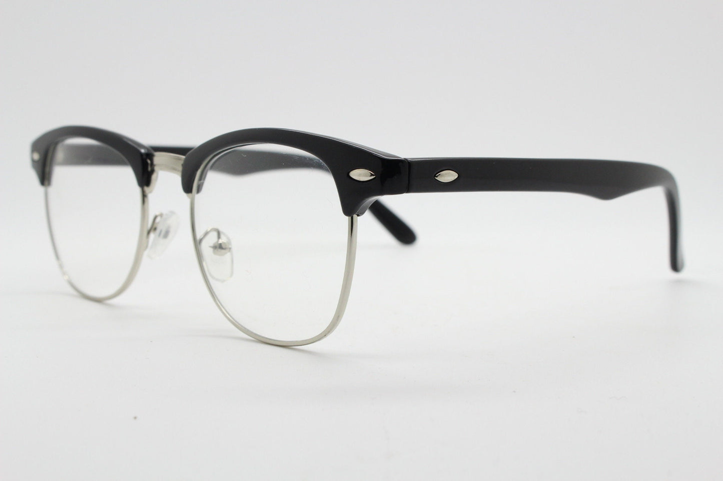 90s vintage black half frame eye glasses. Black gloss browline with silver wire rim frame and clear lenses. Classic 50s, 60s design. NOS