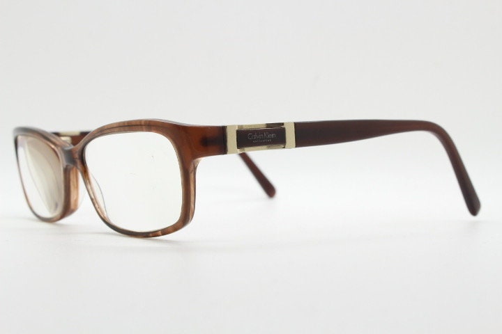 Calvin Klein collection rectangular cat eye glasses model 7851. Tortoise gloss acetate optical frames. Prescription eyeglasses. RX