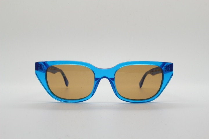 Retrosuperfuture thick cat eye sunglasses hand made in Italy. Intense blue acetate chunky frame with contrasting brown lenses. BNWOT