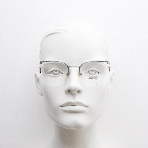 Sting 90s vintage round eye glasses. Minimal pewter finish metal half frame brow line optical frames. Prescription eyeglasses. RX. NOS