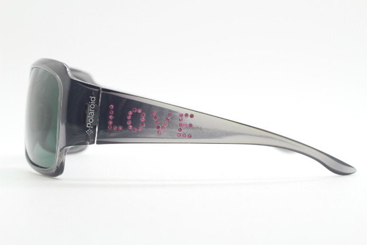 Polaroid Y2K vintage shield sunglasses. Transparent grey wrap around with red diamante LOVE logo and polarising lens. 2000s. Rhinestone