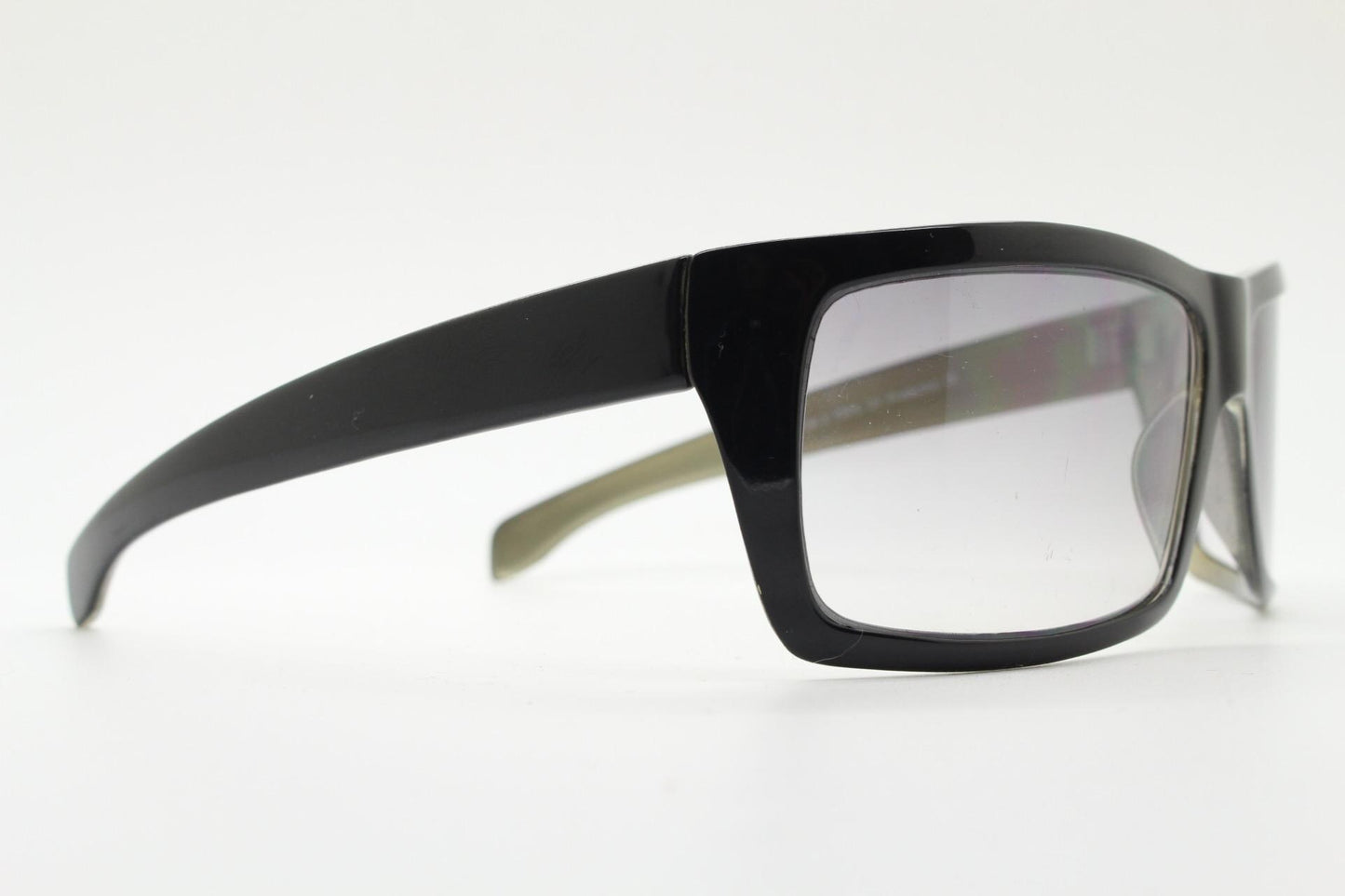 Y2k vintage wrap around large rectangular sunglasses. Curved black gloss frame with tasteful graduating lenses. 2000's NOS