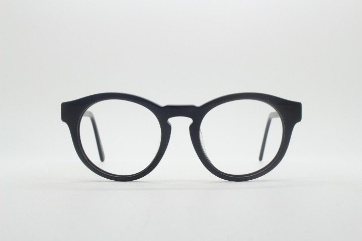 Will i Am round thick frame glasses model 30715554. Black gloss acetate optical frames with keyhole bridge. Prescription eyeglasses. RX