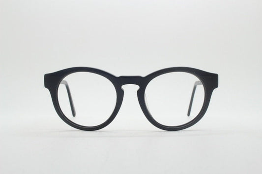Will i Am round thick frame glasses model 30715554. Black gloss acetate optical frames with keyhole bridge. Prescription eyeglasses. RX