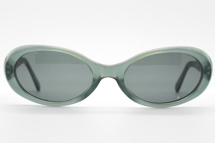 Giorgio Armani 90s vintage oval sunglasses made in Italy. Transparent grey\blue acetate frame with matching lenses. Small bug eye. Y2K