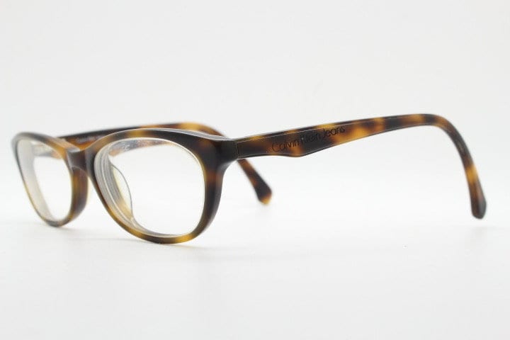Calvin Klein Jeans modified cat eye glasses model CKJ918. Tortoise gloss low profile acetate optical frames. Prescription eyeglasses. RX