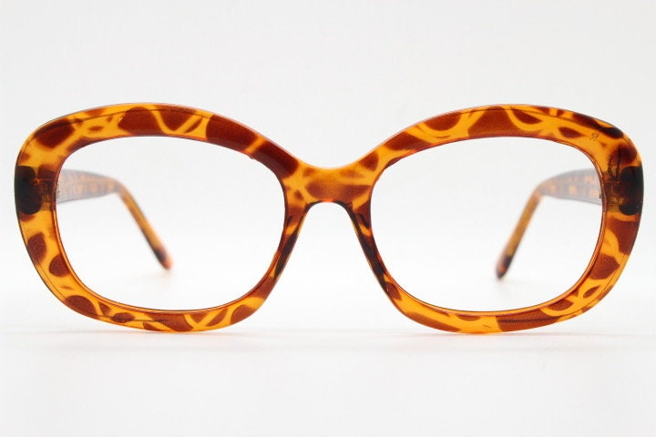 90s vintage angular rounded eye glasses. Transparent vibrant amber giraffe pattern optical frame. Womens prescription eyeglasses. RX
