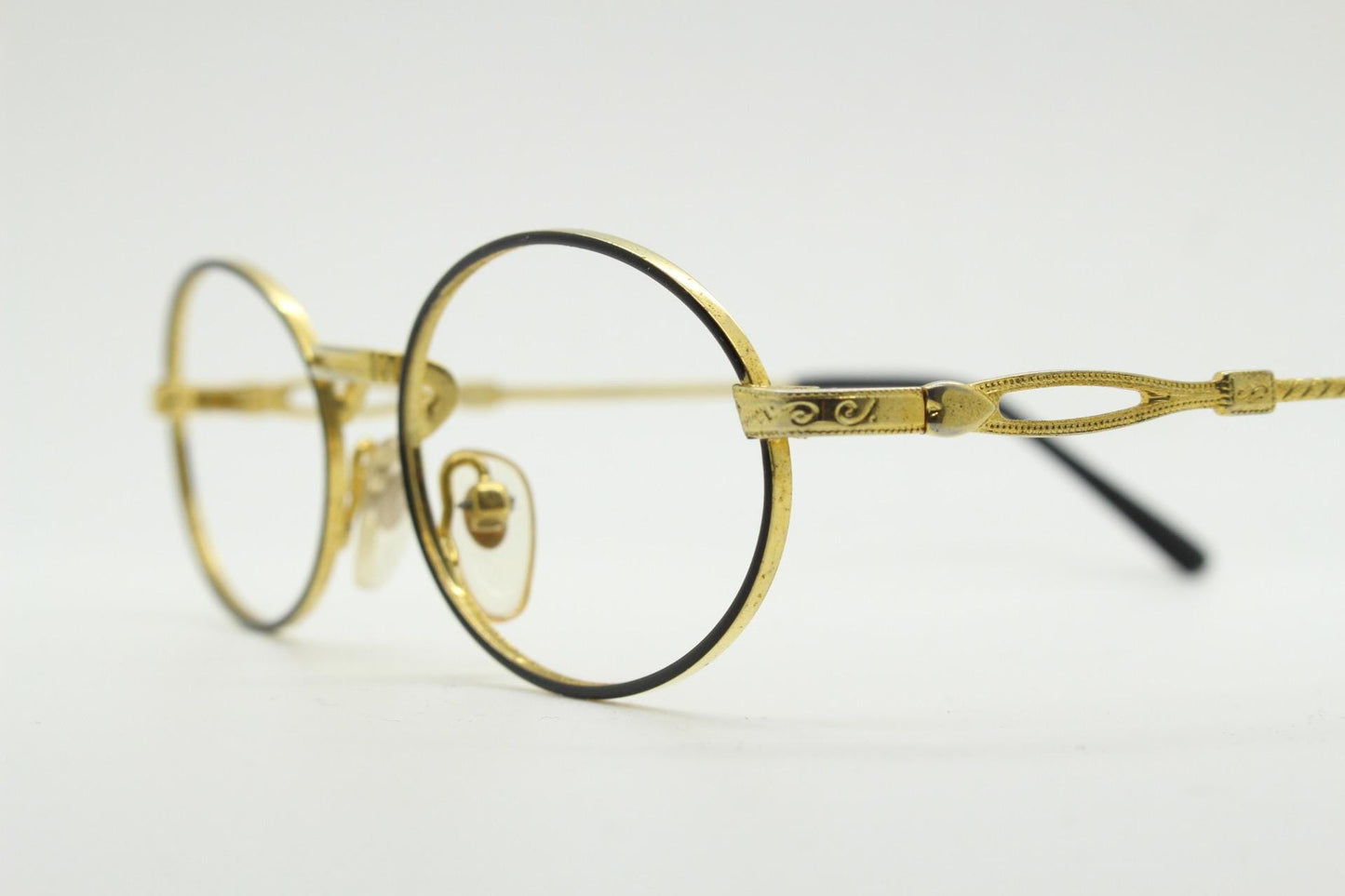 90s vintage small oval eye glasses. Gold and black optical frames with ornate arm details. Prescription RX steampunk spectacles. NOS