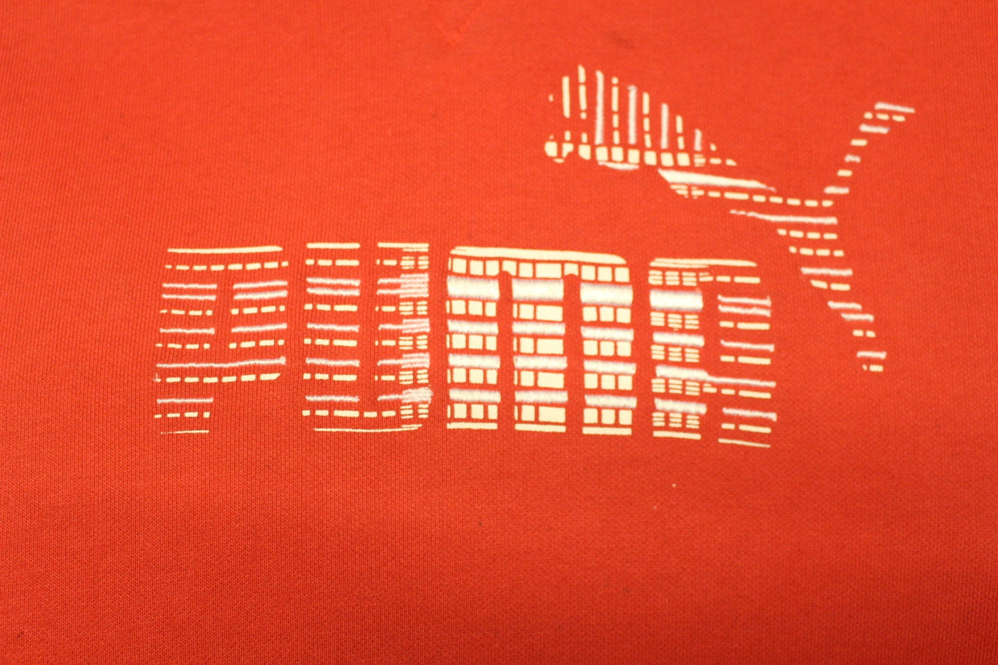 Puma red hoody with big chest logo. Unisex sports pullover sweatshirt with front muffler pockets. UK size L