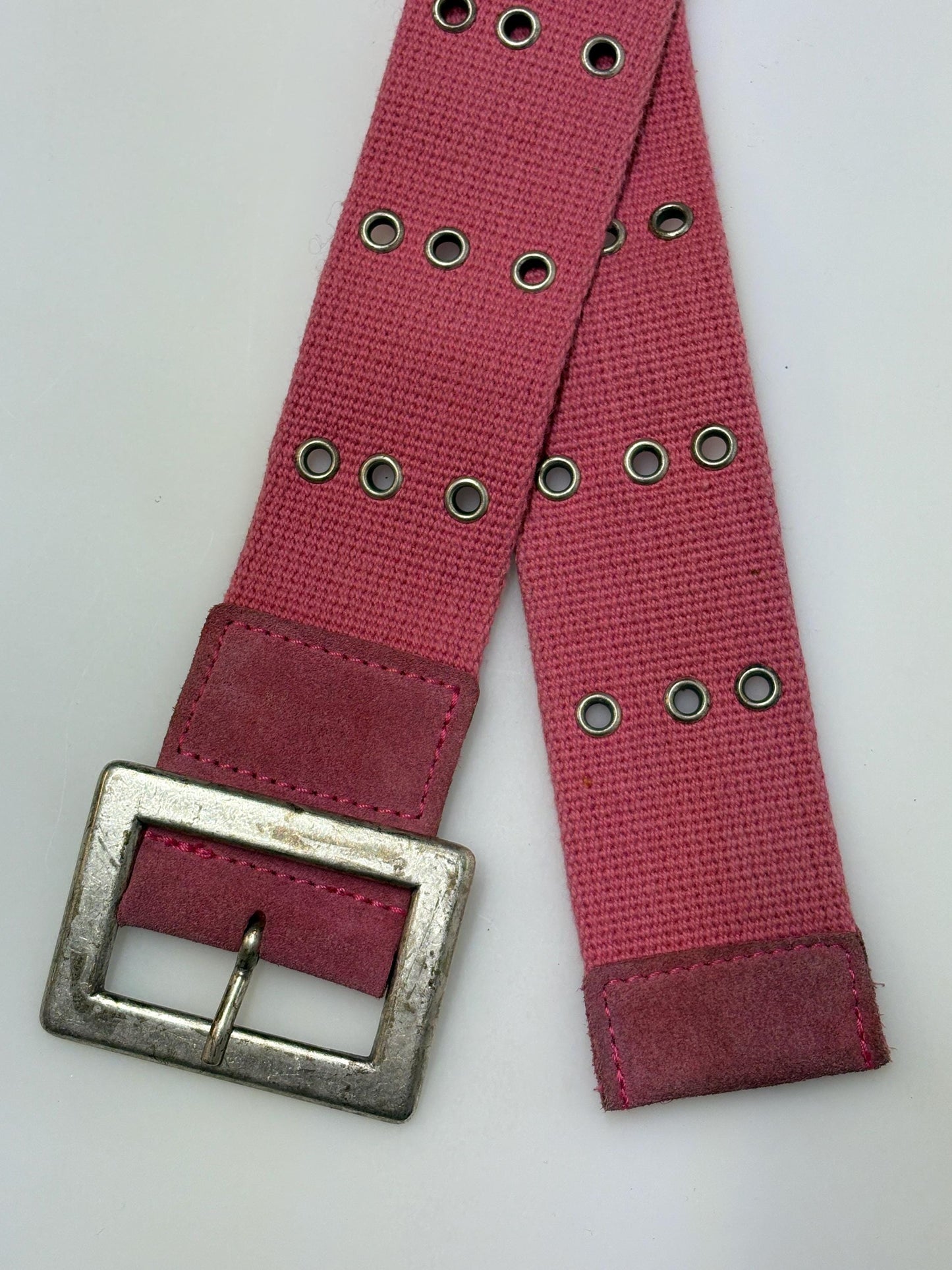 Y2k vintage thick candy pink army style belt with distressed metal buckle and 3 rows of lace holes. Statement feature / to cinch a dress