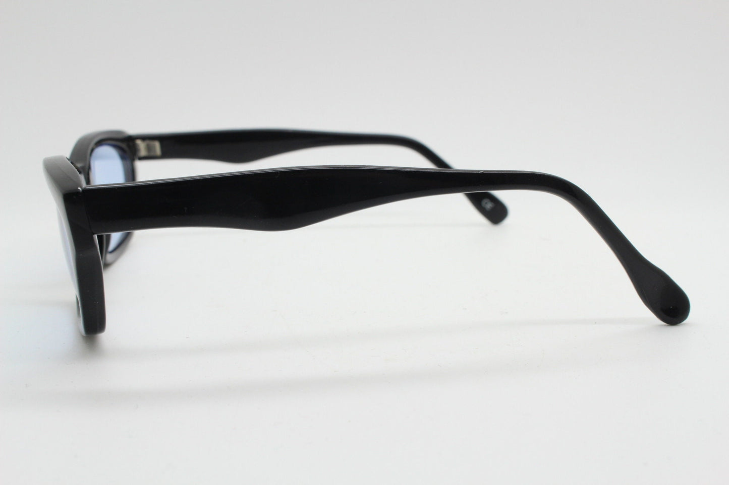 80s vintage rectangular sunglasses. Low profile 60s design black gloss frame with extra light tone sky blue lenses. BNWT Unused NOS