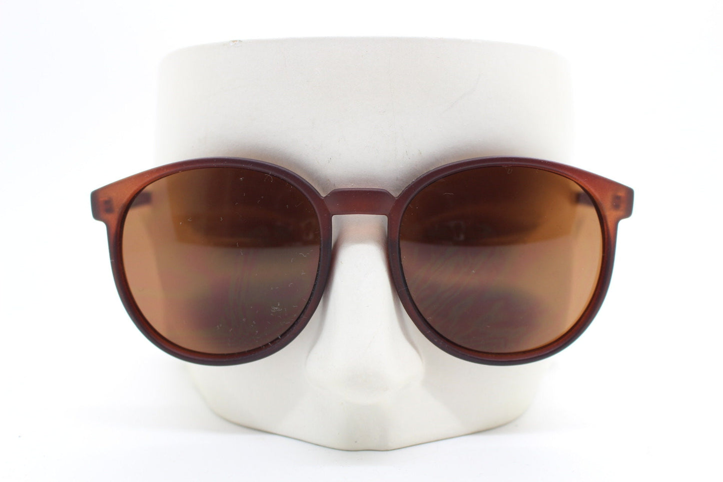 80s vintage round sunglasses. Slightly oversized slim transparent brown frame in a rubber finish with matching lenses. BNWT