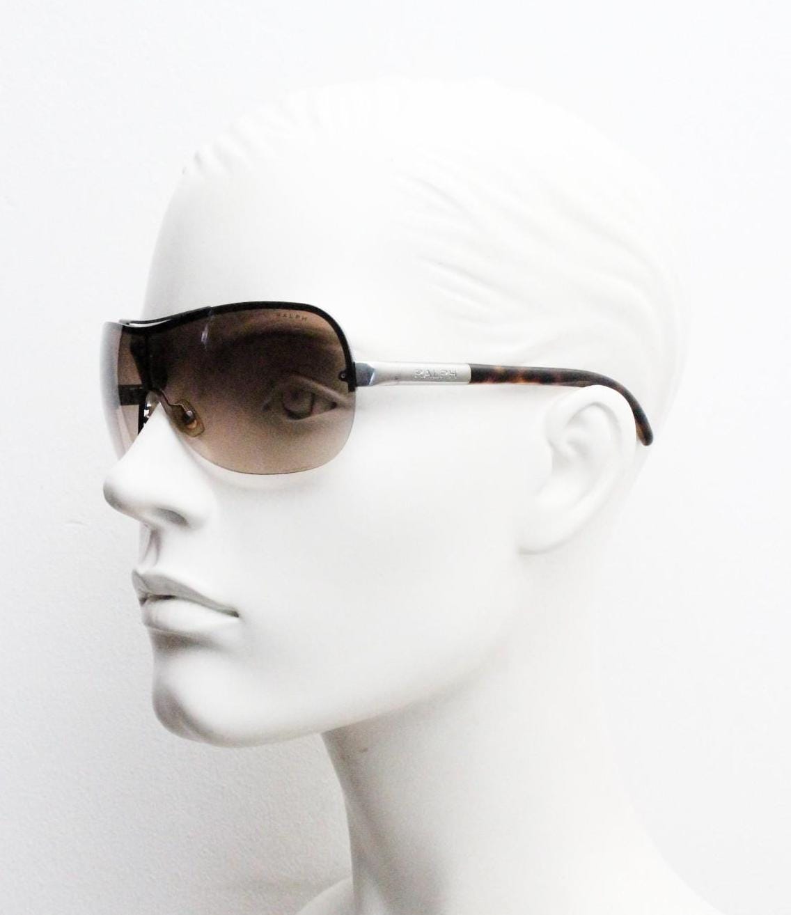 Ralph by Ralph Lauren Y2K vintage big shield sunglasses. 2000's curved wraparound mini mask with graduating mono lens. Aviator