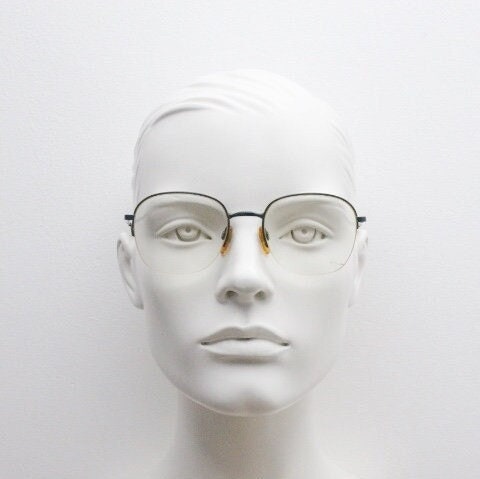 Giorgio Armani round eye glasses made in Italy. Minimal black satin finish half frame spectacles. Prescription optical eyeglasses. RX