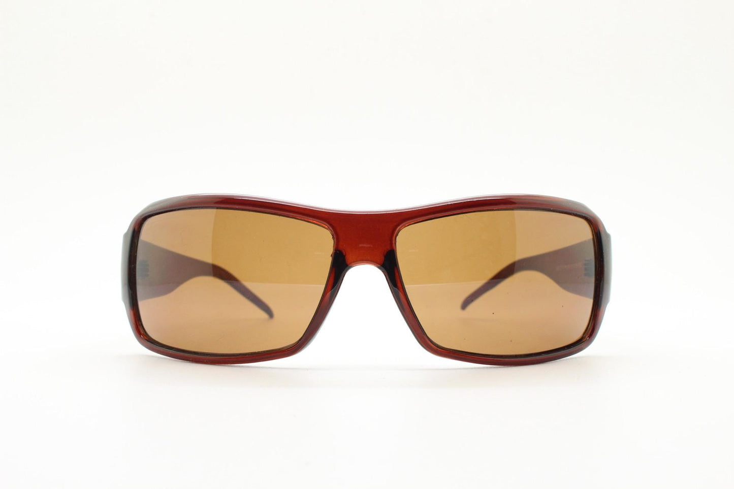 Y2K vintage visor sunglasses. Transparent brown wrap around shield with curved lenses and big X crest. 2000s biker bug eye. NOS