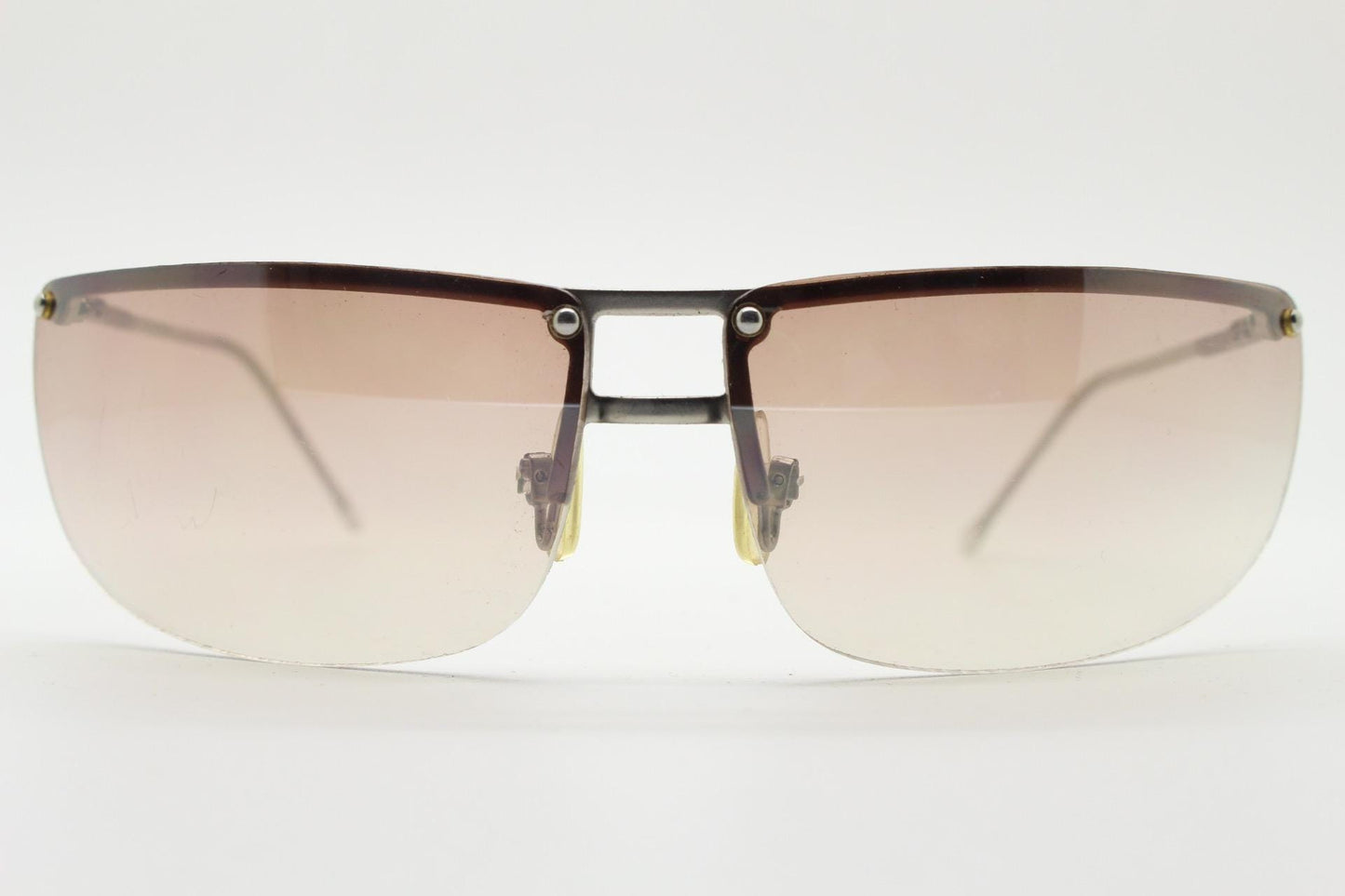 Y2K vintage visor sunglasses. Flat top half frame wraparound shield design with light tone graduating curved lenses. 2000's. NOS