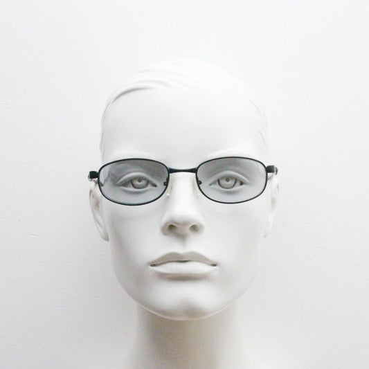 90s vintage oval small bug eye sunglasses. Curved black satin finish metal frame with transparent grey arms and light tone lenses. NOS