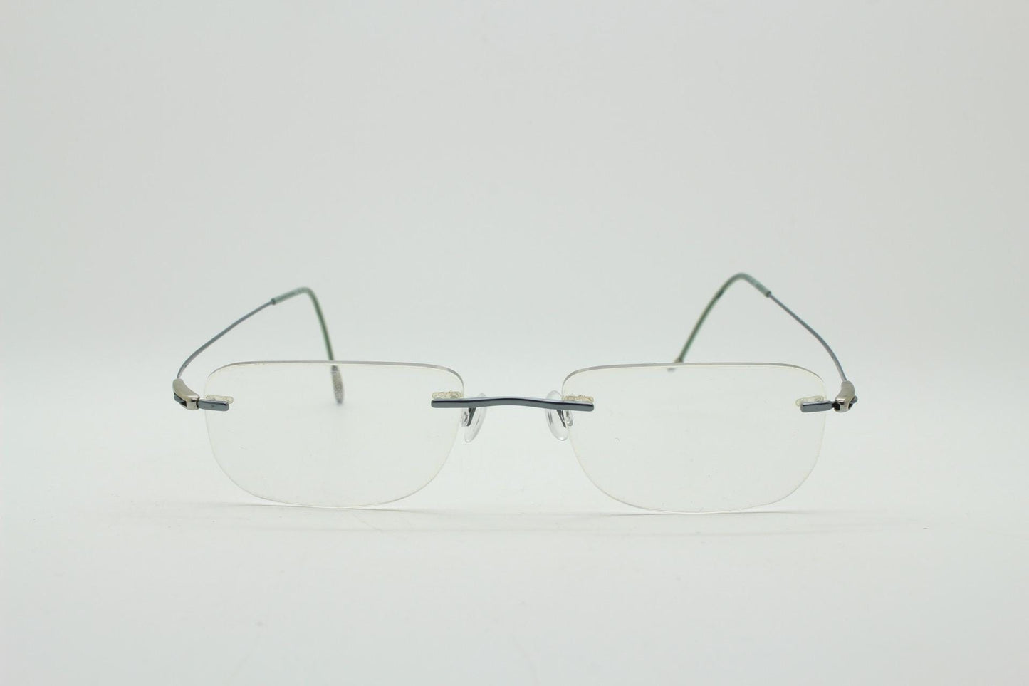 Silhouette rectangular frameless eye glasses model 7554 made in Austria. Minimal lightweight titanium optical frame. Prescription RX