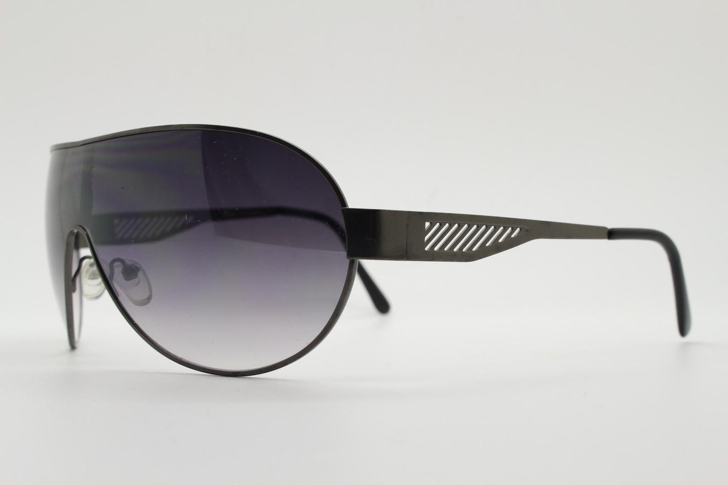 Y2K vintage large mask aviator sunglasses. Grey curved wrap around shield design with graduating monolens and cut out arm stripes. 2000s NOS