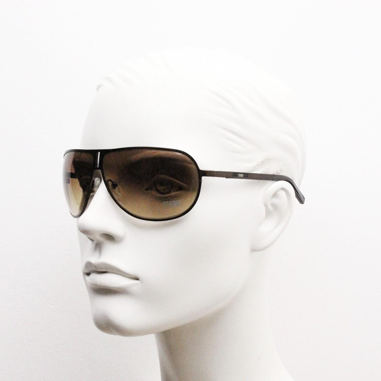 Storm Y2K bug eye aviator sunglasses model Photon. Bronze satin finish shield style aviators with graduating brown lenses.  Unused NOS.