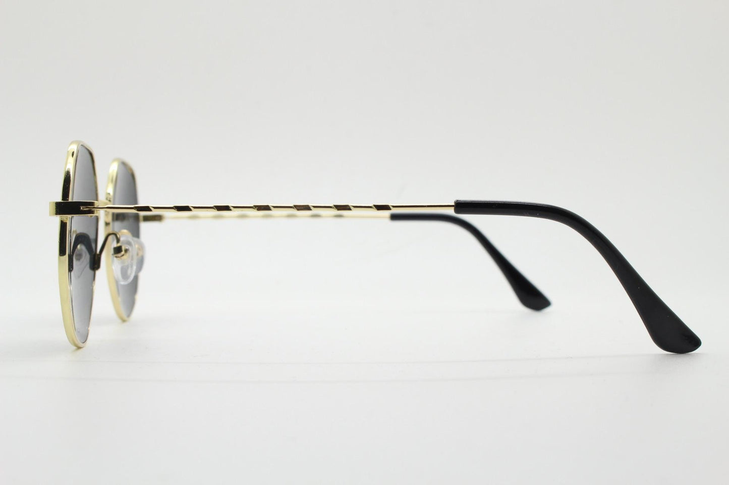 90s vintage modified aviator sunglasses, 6 sided soft angled metal frame in gold chrome with indented patterned arms. Unused NOS