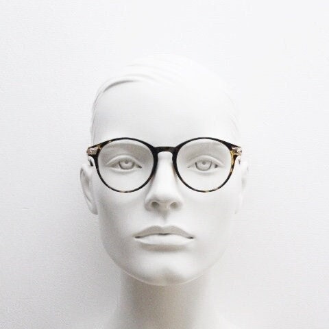90s vintage round glasses with tortoise front and gold embossed arms. 40s, 50s style prescription optical frames. Clear lens eyeglasses. RX