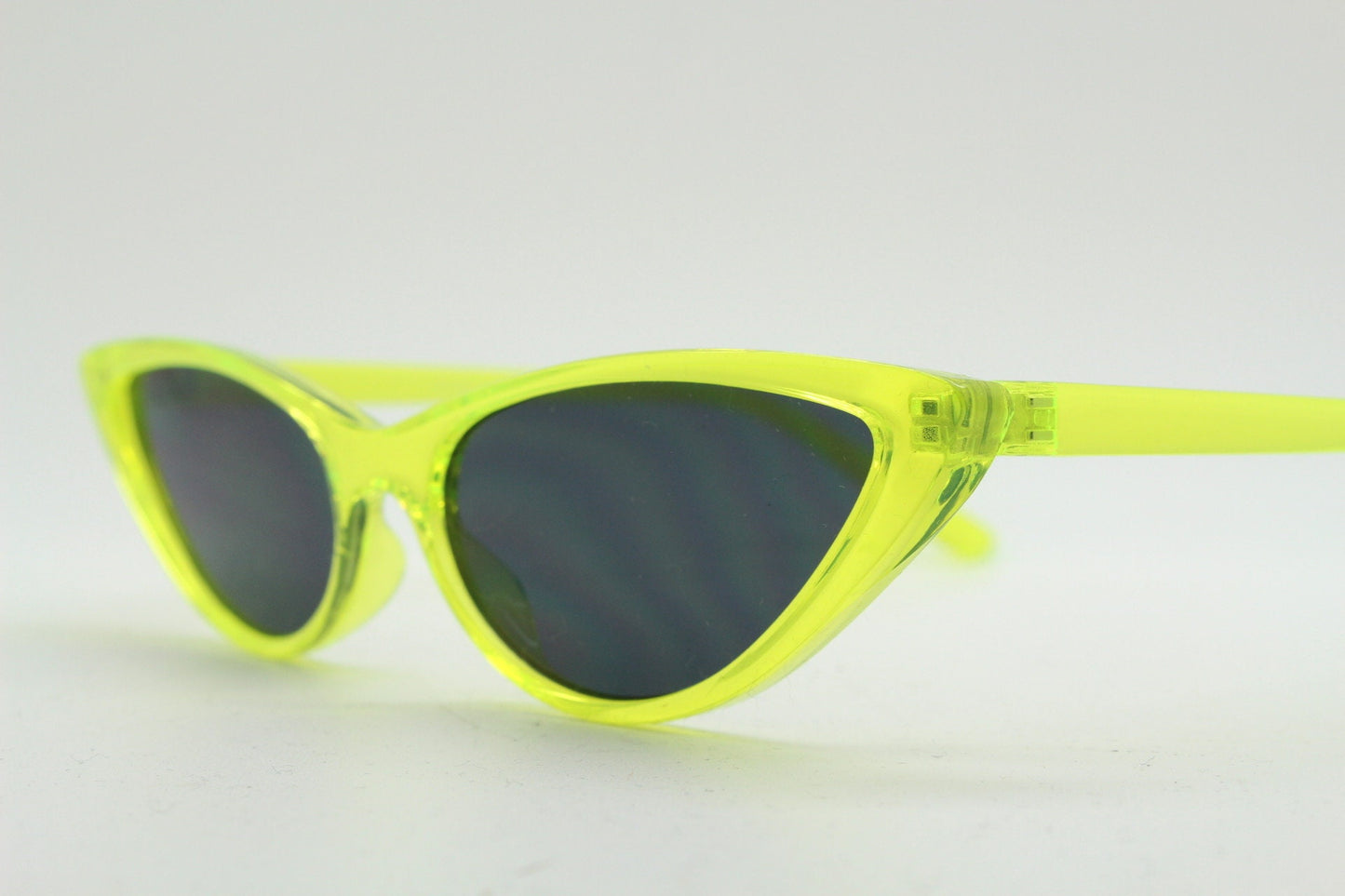 Y2K vintage extreme pointed cat eye sunglasses. Stylised yellow transparent frame with black lenses. Womens 50s style psychabilly. NOS