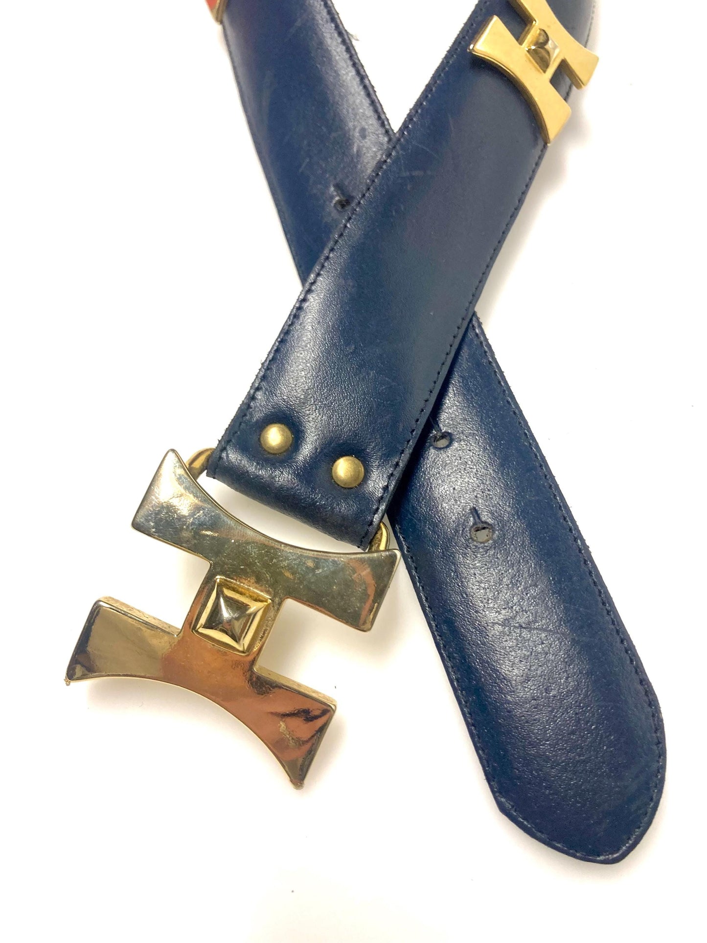 80s vintage womens dress belt in navy blue genuine leather with substantial gold chrome studded 'H' motifs. Made in France. Size S