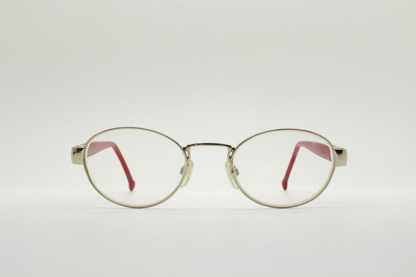 Red or Dead Y2K vintage oval eye glasses. Green or red interchangeable arms on a chrome metal frame. Optical prescription eyeglasses. RX