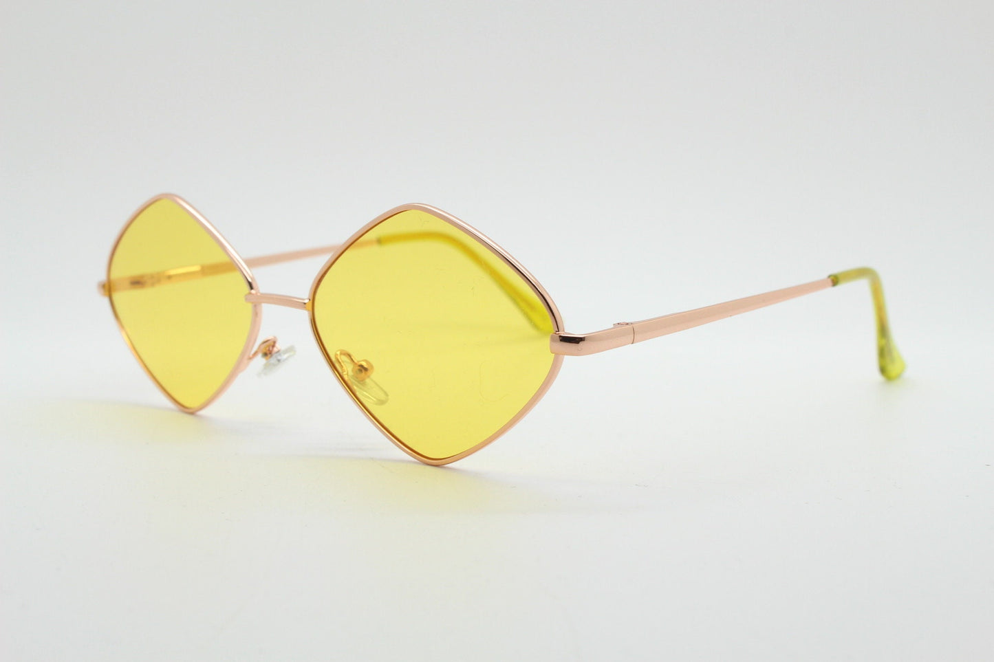 90s vintage diamond sunglasses. Minimal rose gold frame with psychedelic mod style yellow lenses. Unused BNWT
