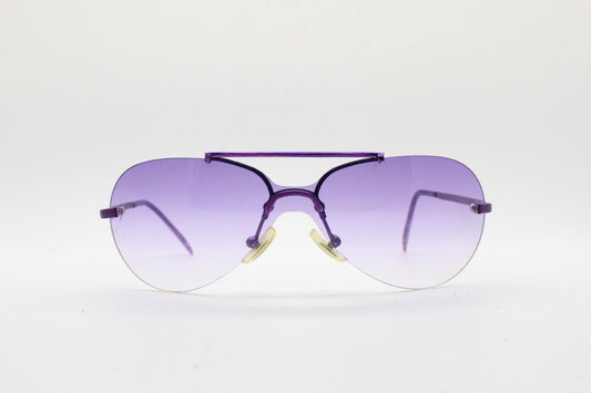 Y2K vintage small sized aviator sunglasses. Frameless graduating mono lens with metallic purple metal arms and bridge. 2000s aviators