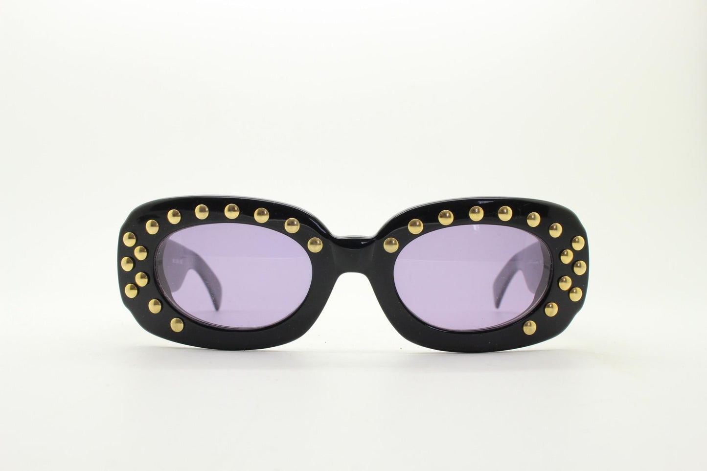 Lanvin vintage thick frame oval sunglasses with large golden dome studs. Womens 60s shape black acetate frame with atmospheric purple lenses