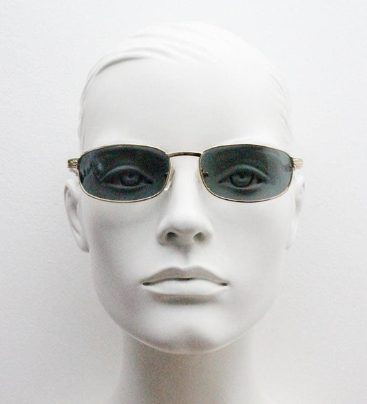 90s vintage low profile gold rectangular sunglasses. Solid metal frame in a shiny chrome finish embossed arm pattern and green lenses. NOS