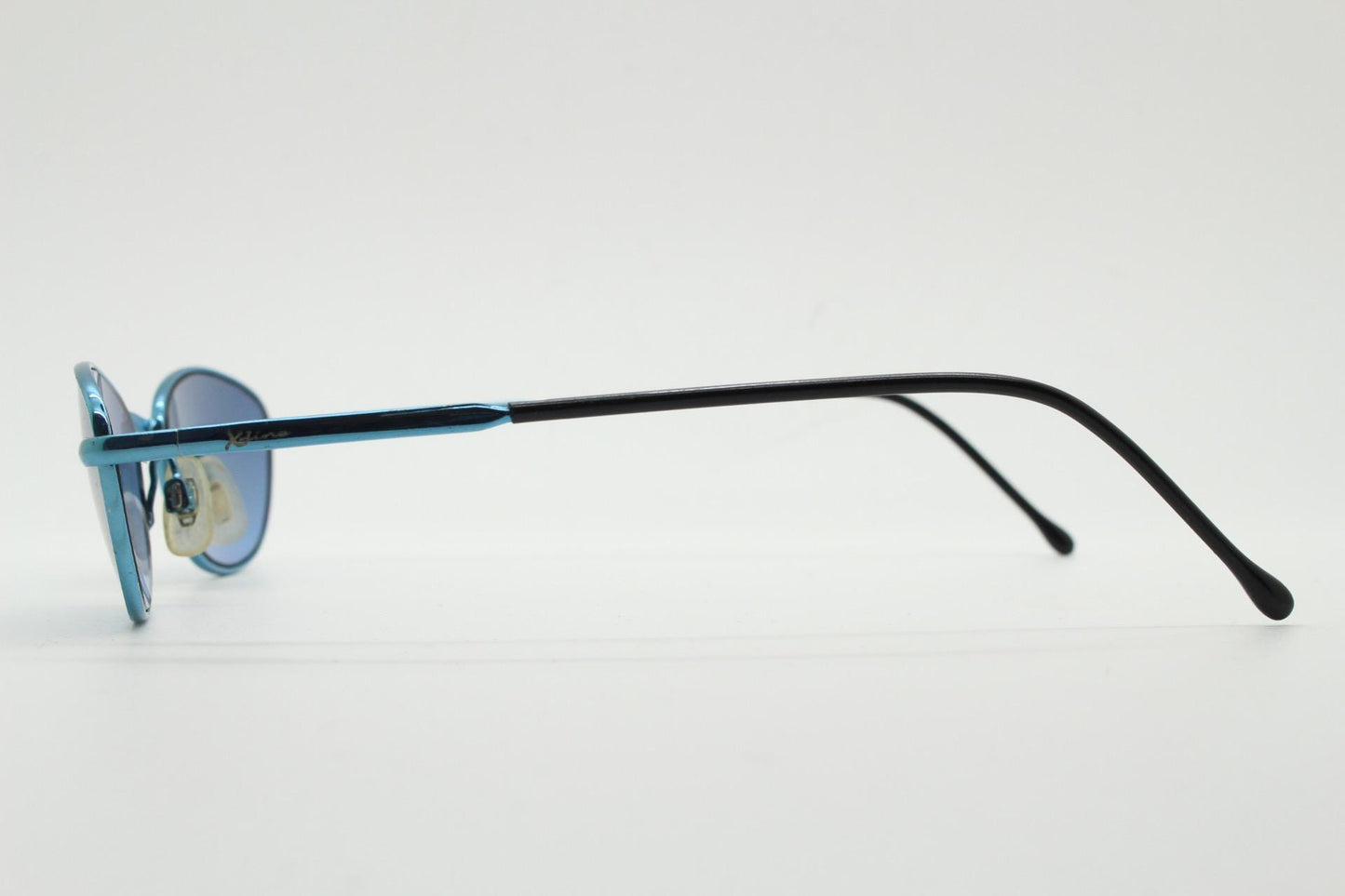 90s vintage small oval sunglasses by X-line. Unusual blue chrome metal frame with well matched mirror lenses. Quality NOS