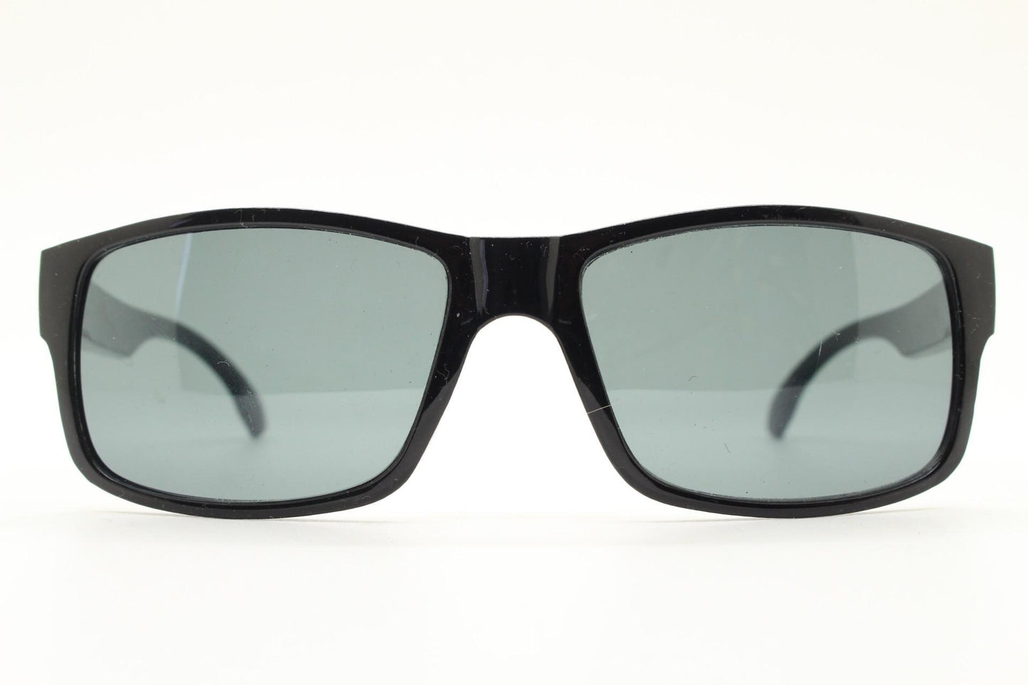 Y2K vintage sharp rectangular sunglasses. Large curved black gloss frame with dark green lenses and silver arrow arm crests. NOS