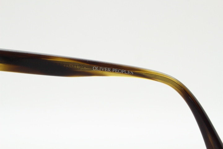 Oliver Peoples vintage rectangular sunglasses model Maceo. Handsome transparent mottled honey brown acetate frame with mid tone lenses