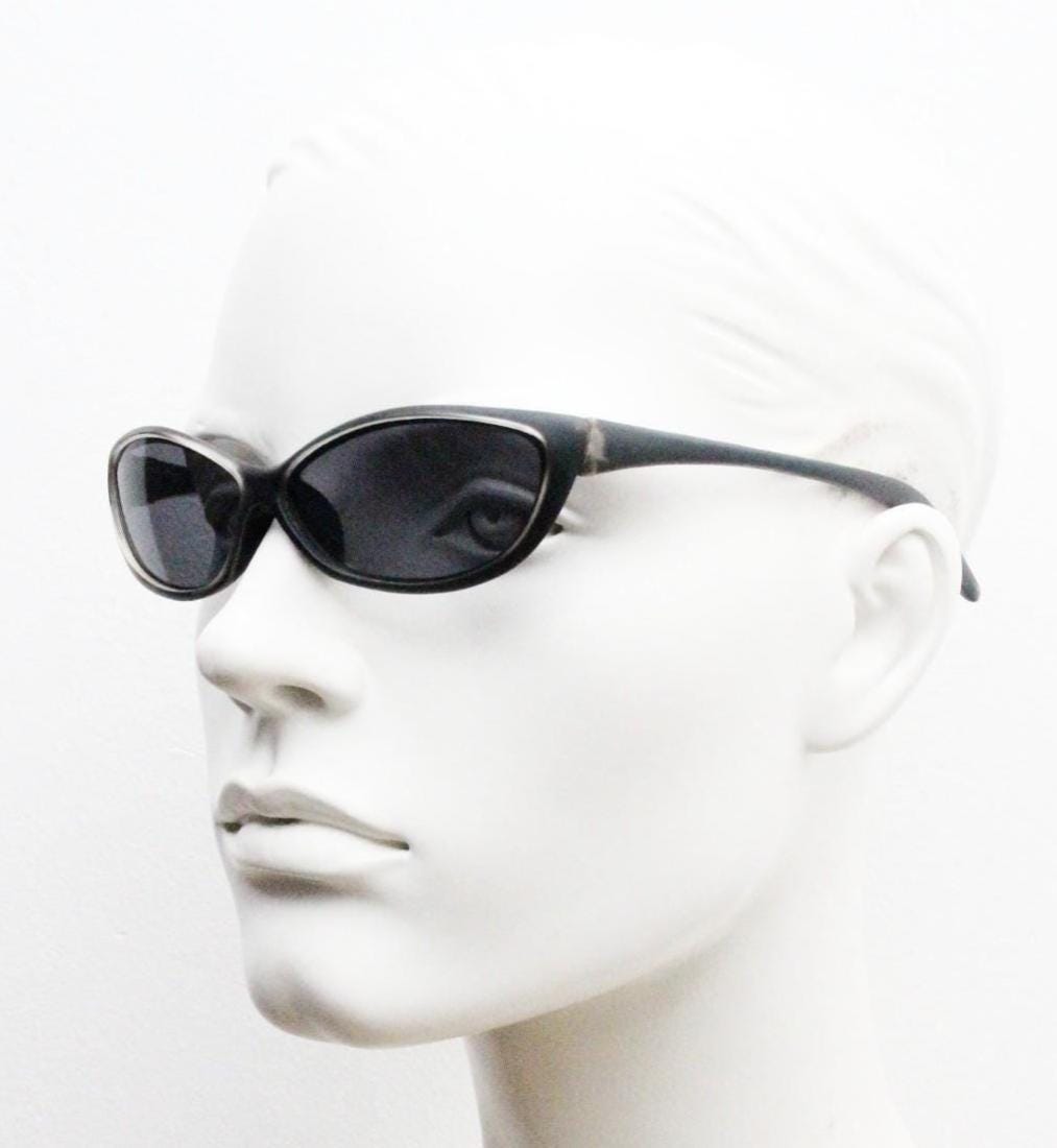 90s vintage curved wraparound sunglasses. Aerodynamic low profile transparent grey frosted frame. Minimal sporty shield design. NOS