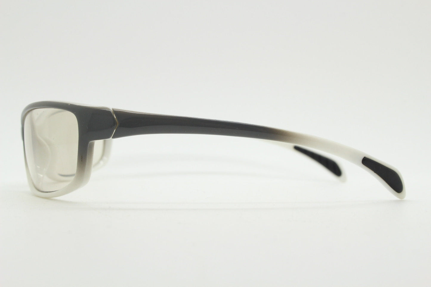 Y2K vintage futuristic sunglasses. Gloss white and grey wrap around shield style frame with light tone lenses. Cosplay visor. 2000s NOS