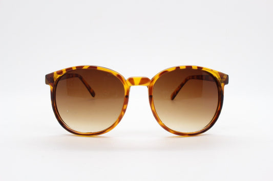 80s vintage round sunglasses. Slightly oversized slim honey tortoise frame with graduating lenses. Unworn NOS